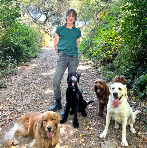 ely with pups on trail